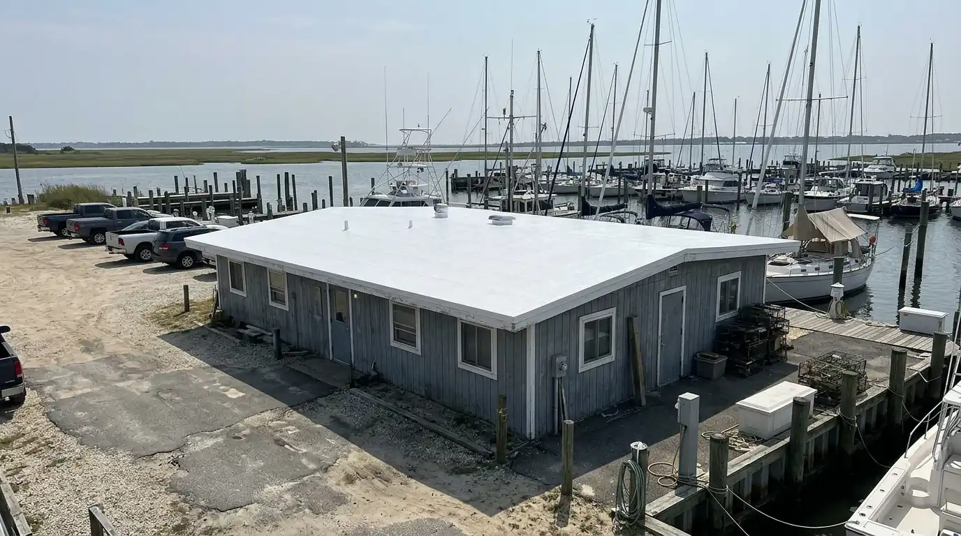 Freshly coated white roof on a building near a marina